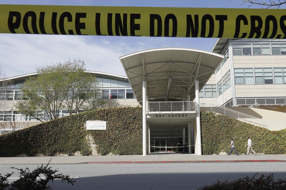 Police tape is shown outside of a YouTube office building in San Bruno, Calif., Wednesday, April 4, 2018. A woman suspected of shooting three people at YouTube headquarters before killing herself was furious with the company because it had stopped paying her for videos she posted on the platform, her father said Tuesday, April 3, 2018. (Jeff Chiu / Associated Press)