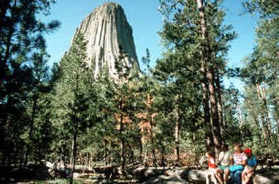 
Devils Tower, a high-rise volcanic formation in northeastern Wyoming, was named the first national monument in 1906 and still attracts hikers, climbers, sightseers — and film crews.Devils Tower, a high-rise volcanic formation in northeastern Wyoming, was named the first national monument in 1906 and still attracts hikers, climbers, sightseers — and film crews.
 (Associated PressAssociated Press / The Spokesman-Review)