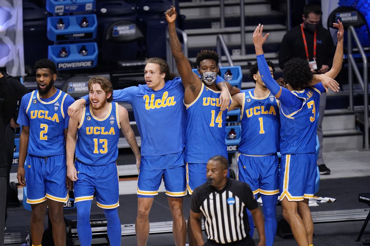 UCLA basketball players celebrate their win over BYU after a first-round game in the NCAA college basketball tournament at Hinkle Fieldhouse in Indianapolis, Saturday, March 20, 2021.  (Associated Press)