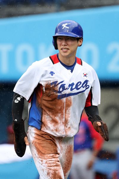 Infielder Hyeseong Kim of Team Republic of Korea celebrates scoring a run in the fifth inning against Team Dominican Republic during the bronze medal game of the Tokyo 2020 Olympic Games at Yokohama Baseball Stadium on Aug. 7, 2021, in Yokohama, Japan.   (Tribune News Service)