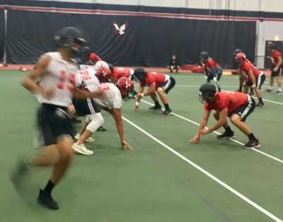 Eastern Washington football players were forced to practice inside on Tuesday. (Jim Allen / The Spokesman-Review)