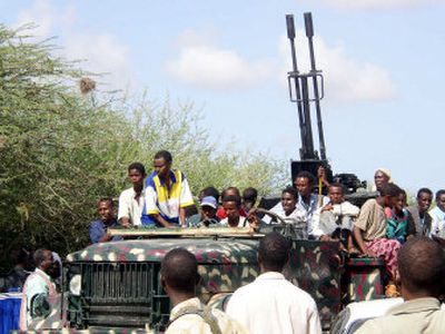 
Somalia Islamic militia members sit on a truck carrying an anti-aircraft gun that they seized from a secular alliance of warlords Monday after they took control of a neighborhood in Mogadishu. 
 (Associated Press / The Spokesman-Review)