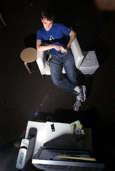 
Colin Plamondon, 17, tries out Microsoft's newest videogame console, the Xbox 360, at a preview event last week at the company's campus in Redmond, Wash. 
 (Associated Press / The Spokesman-Review)