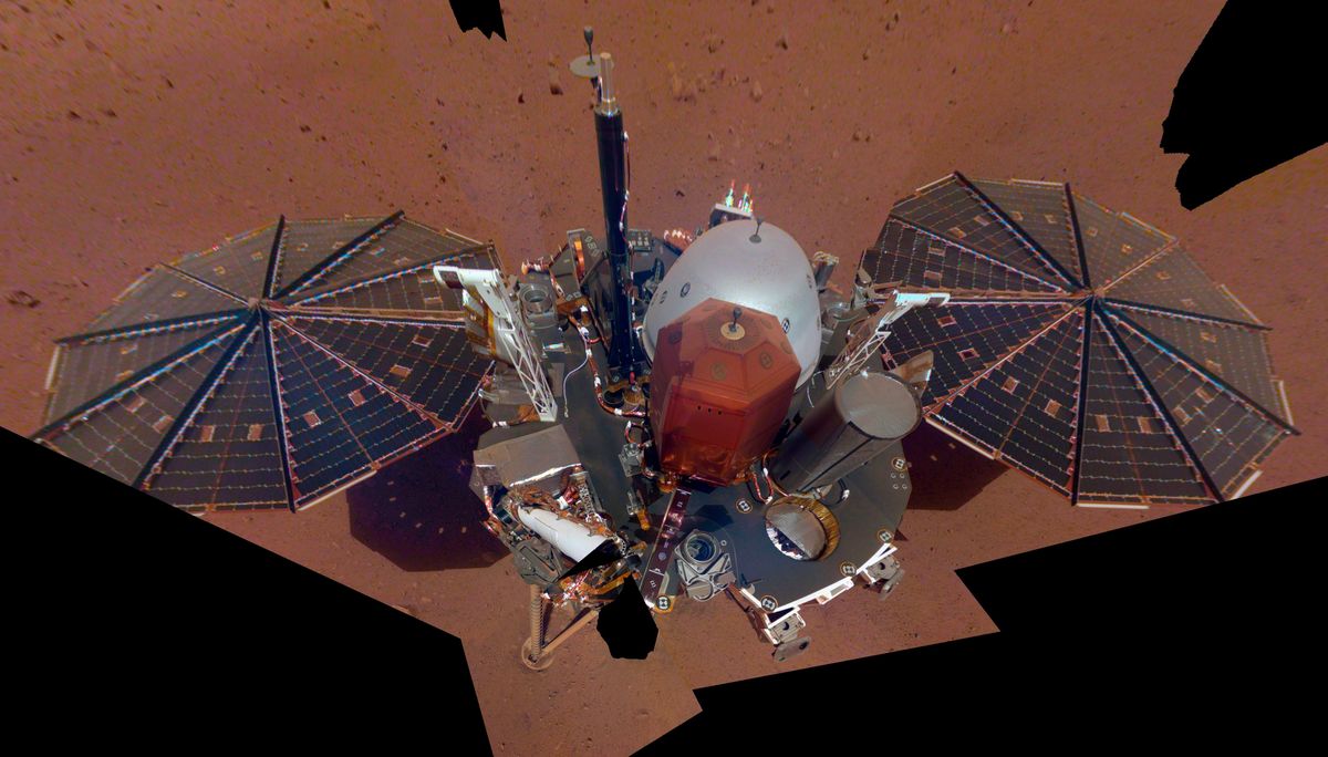 FILE – This Dec. 6, 2018 image made available by NASA shows the InSight lander. The scene was assembled from 11 photos taken using its robotic arm. The spacecraft is losing power because of all the dust that’s accumulated on its solar panels. NASA said Tuesday, May 17, 2022, it will keep using the spacecraft’s seismometer to detect marsquakes until its power peters out. Officials expect operations to cease in July, almost four years after InSight’s arrival at Mars.  (HOGP)
