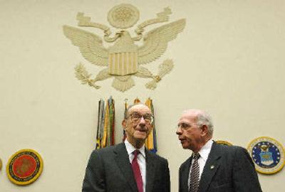 
Federal Reserve Chairman Alan Greenspan listens to committee chairman Jim Saxton, R-N.J., before testimony to the congressional Joint Economic Committee on Capitol Hill on Thursday. 
 (Associated Press / The Spokesman-Review)