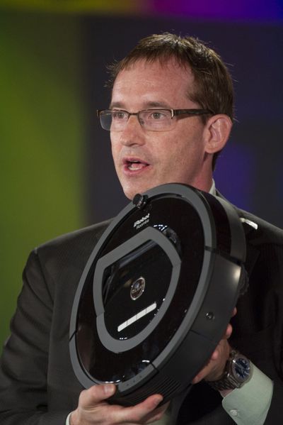 Colin Angle, CEO and co-founder of iRobot Corp., displays an iRobot Roomba robot  in Half Moon Bay, Calif., on June 18, 2013.  (Bloomberg )