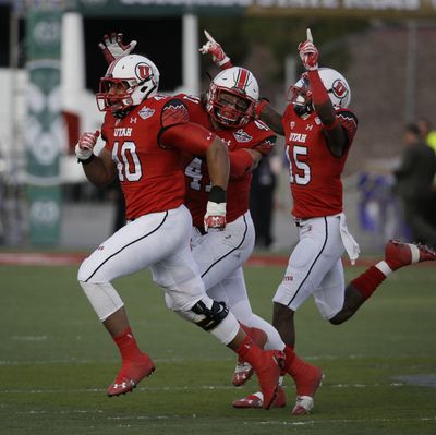 From left, Utah’s Jacoby Hale, Jared Norris and Dominique Hatfield celebrate as things go their way in second-half action. (Associated Press)