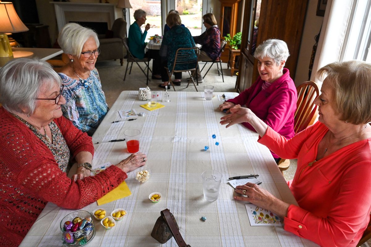 Clockwise from left, Ginny Gambill, Cheryl Nelson, Lynda Hutchins and Sheila Miller gather at Table 1 to play bunko on April 10 in Spokane.  (DAN PELLE/THE SPOKESMAN-REVIEW)