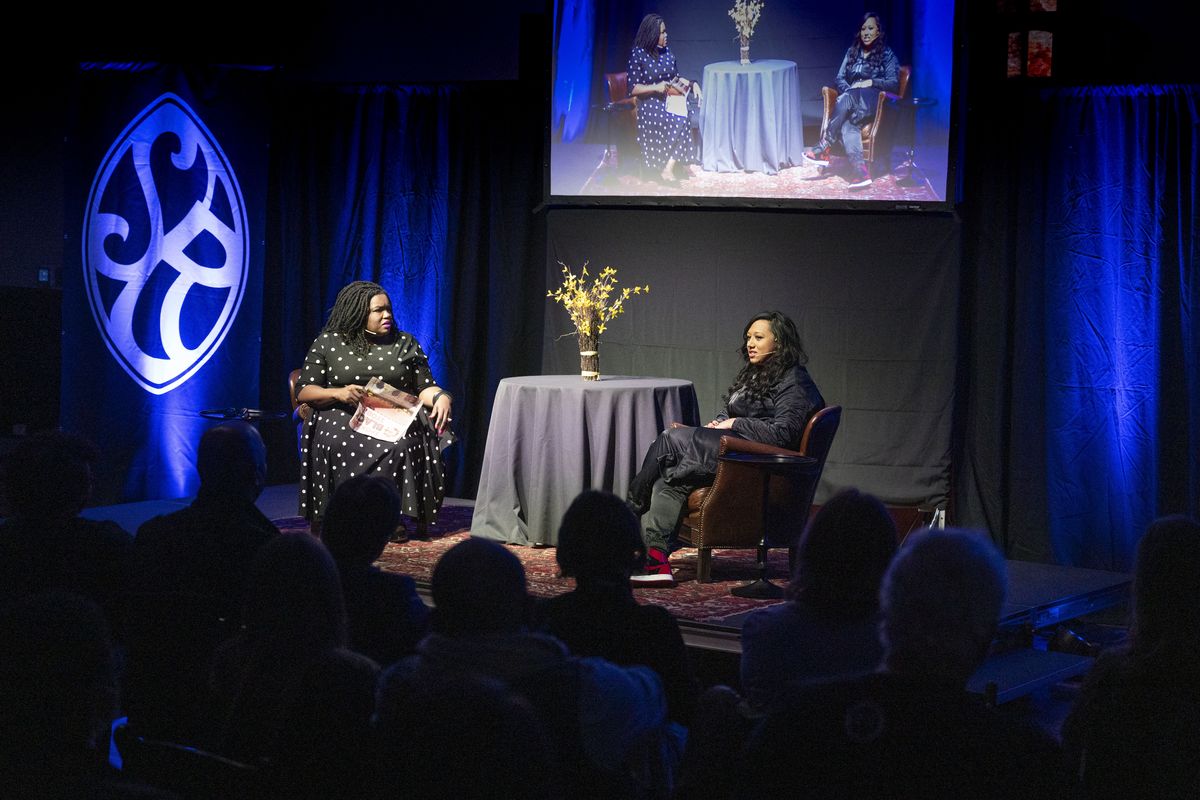 NAACP President and Spokesman-Review columnist Kiantha Duncan, on left, talks with TV Producer Mandi Price about her experiences from Spokane to Hollywood, at a Northwest Passages event held, Wednesday, Feb. 16, 2022, in the Montvale Event Center.  (COLIN MULVANY/THE SPOKESMAN-REVI)