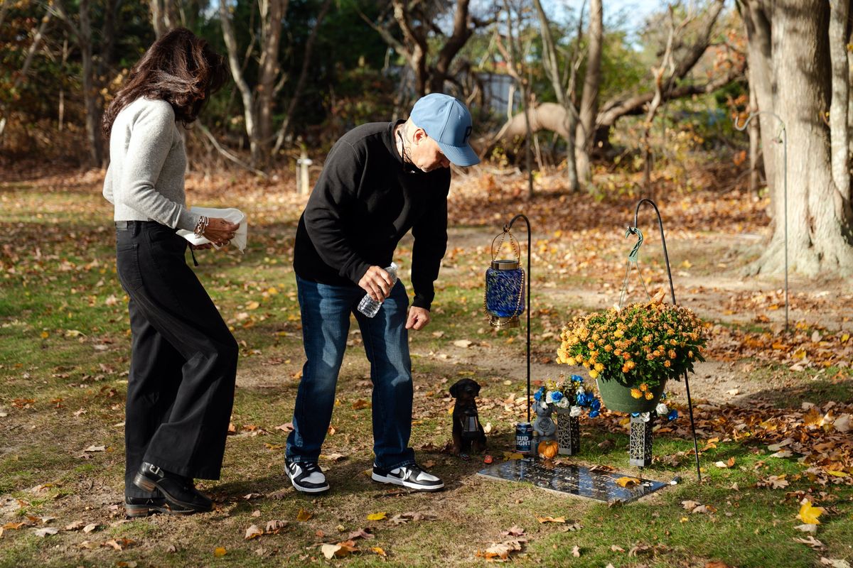 Angela and Timothy Kimball place flowers on the grave of their son, TJ Kimball, on Nov. 4 in Plymouth, Mass. Kimball’s death was a private tragedy that underscores a widespread risk in the stressful construction field.  (SOPHIE PARK)