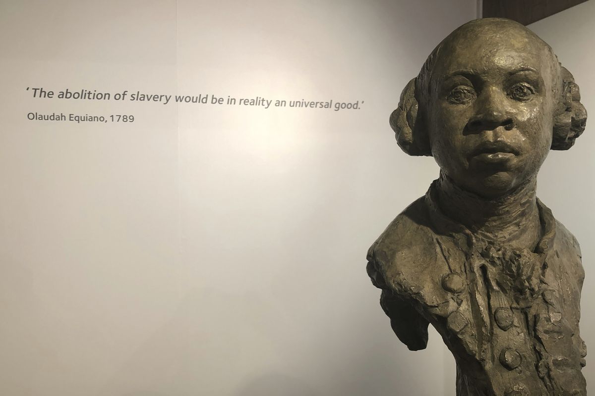 In this Nov. 24, 2019 photo, a sculpture of former slave and later abolitionist, writer Olaudah Equiano by London based artist Christy Symington, sits on display at the International Slavery Museum in Liverpool, England, Britain. Activists and towns in the U.S. are left wondering what to do with empty spaces that once honored historic figures tied to racism as statues and monuments fell in June 2020. The Equiano image has been suggested as a replacement.  (Russell Contreras)