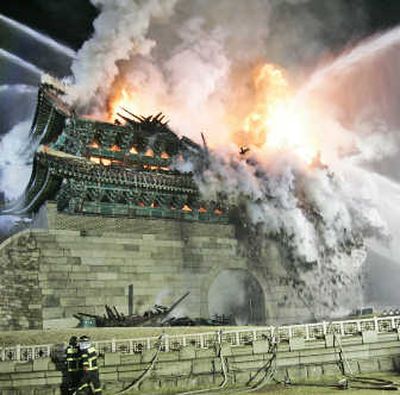 
Firefighters extinguish a blaze at Namdaemun in Seoul today. Associated Press
 (Associated Press / The Spokesman-Review)