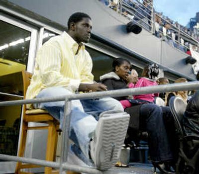 
Seattle Seahawks wide receiver Deion Branch is just another fan in the stands as he recovers from a sprained right foot. Associated Press
 (Associated Press / The Spokesman-Review)