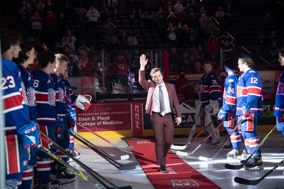 Former Spokane Chief Tyler Johnson waves to the Arena crowd Friday after he was introduced before the game for a special ceremony to retire his No. 9.  (Jesse Tinsley/The Spokesman-Review)