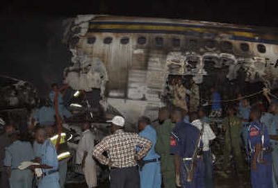 
Rescuers attend the scene where a Sudanese jetliner veered off a runway and exploded into flames, at the airport in Khartoum late Tuesday. Associated Press
 (Associated Press / The Spokesman-Review)