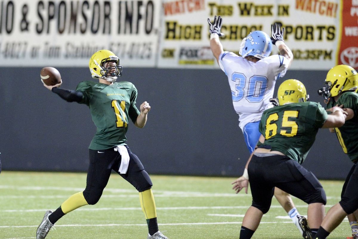 Shadle Park’s Brett Rypien winds up to pass as Central Valley’s Travis Hawkins defends. (Jesse Tinsley)