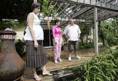 
A Florida real estate broker shows a home to prospective buyers in Florida. 
 (Associated Press / The Spokesman-Review)