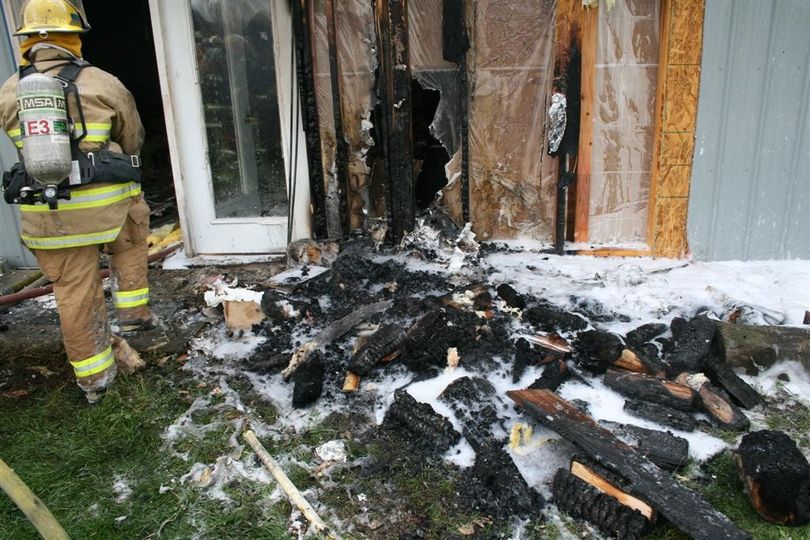 This home in the 4300 block of North Harvard Road burned Nov. 8 after hot wood stove ashes were left next to a woodpile, which caught on fire and then spread the flames to the home.  (Photo courtesy Spokane Valley Fire Department)