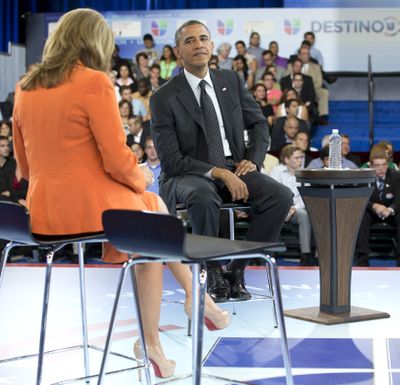 President Barack Obama participates in a town hall hosted by Univision and Univision news anchor Maria Elena Salinas, left, at the University of Miami, Thursday, Sept. 20, 2012, in Coral Gables, Fla. (Carolyn Kaster / Associated Press)