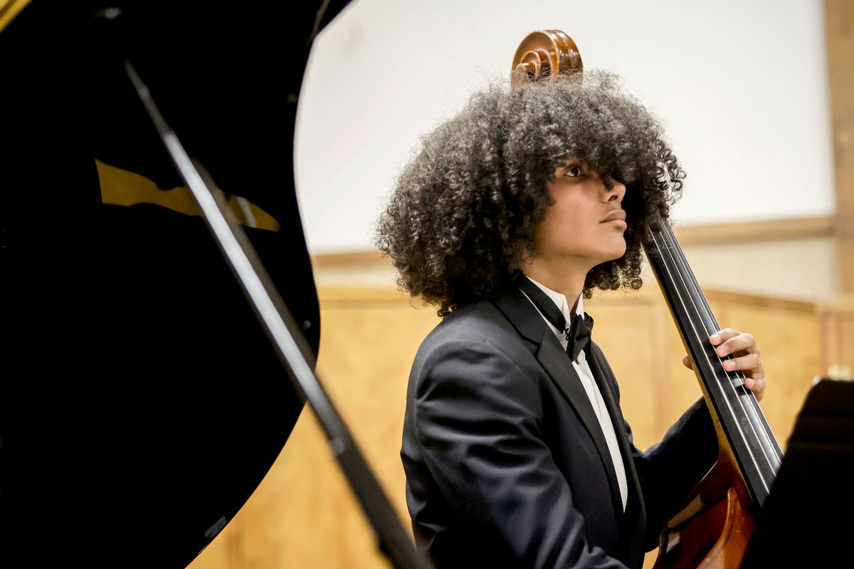 Corey Hodges plays the bass with the Shadle Park High School jazz ensemble on Friday at the University of Idaho’s Lionel Hampton Jazz Festival in Moscow, Idaho.  (Geoff Crimmins/For The Spokesman-Review)