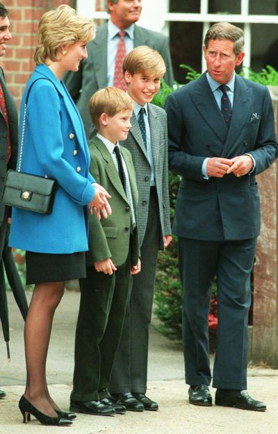 Letters written by the late Princess Diana, second left, (pictured with Prince Charles and their sons Harry and William) were auctioned off in London on Thursday. (LYNNE SLADKY / AP)