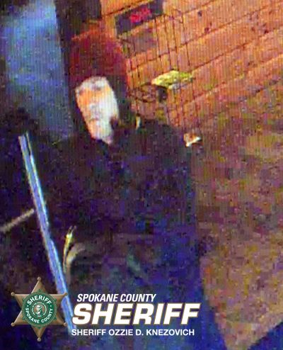 A surveillance photo shows a man Spokane County Sheriff's Office detectives believe robbed pot shop Greenlight on Monday, Aug. 3, 2015. Two men are believed to have robbed the store in a 