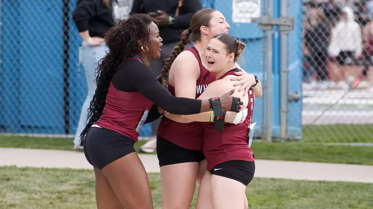 Whitworth throwers Amblessed Okemgbo, left, Madison Carr and Kylie Loveless celebrate after sweeping the shot put at the Northwest Conference championships on Saturday at Boppell Track.  (Courtesy of Whitworth Athletics)