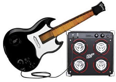 
Music toys, like Hasbro's Power Tour Electric Guitar, are popular this year.
 (The Spokesman-Review)