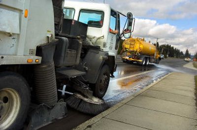 
Carey Phillips drives a street sweeper along Dishman-Mica Road in Spokane Valley on Friday. Street sweepers cleaned Dishman-Mica and University roads in preparation for spring and summer. 
 (Kathryn Stevens / The Spokesman-Review)