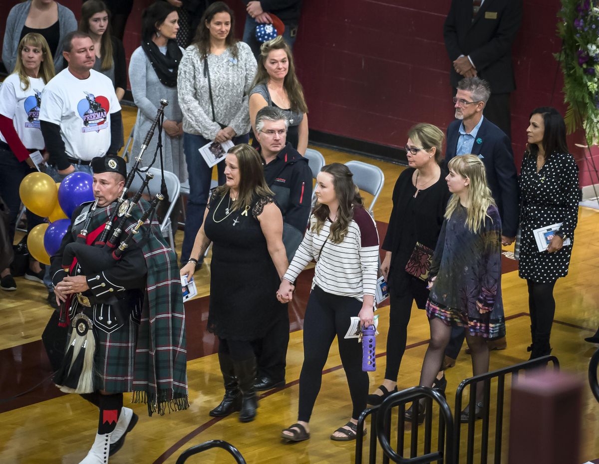 At the Saturday memorial for Freeman High School student Samuel Strahan, mother Ami and sister Emily enter the University High School gym. (Colin Mulvany / The Spokesman-Review)