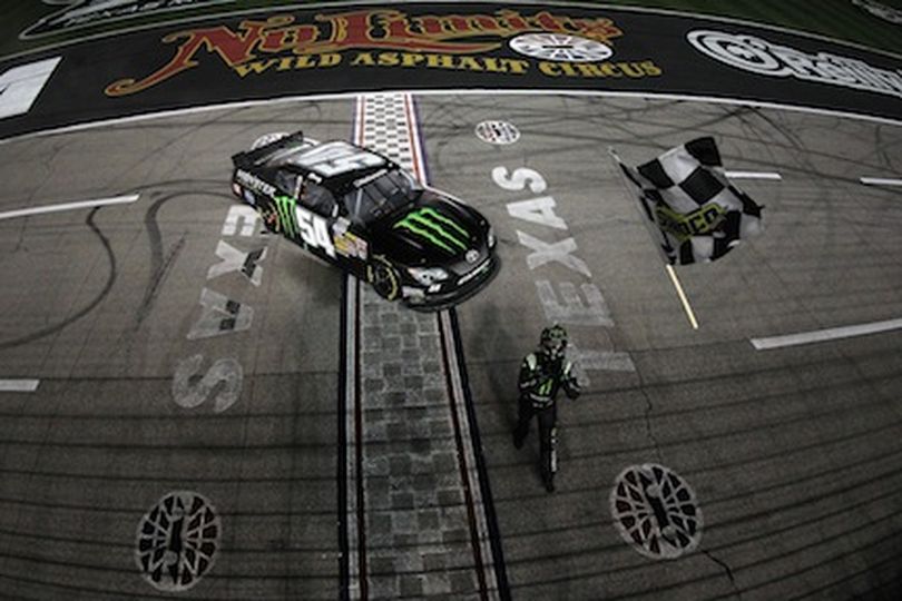 Kyle Busch, driver of the #54 Monster Energy Toyota, celebrates with the checkered flag after winning the NASCAR Nationwide Series O'Reilly Auto Parts 300 at Texas Motor Speedway on April 12, 2013 in Fort Worth, Texas. (Photo Credit: Tom Pennington/NASCAR via Getty Images) (Todd Warshaw / Nascar)