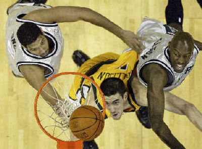 
Seattle's Nick Collison, center, battles inside against San Antonio. 
 (Associated Press / The Spokesman-Review)