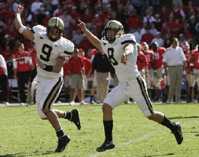 
Vanderbilt  kicker Bryant Hahnfeldt (8) and holder Mackenzi Adams (9) celebrate Saturday. 
 (Associated Press / The Spokesman-Review)