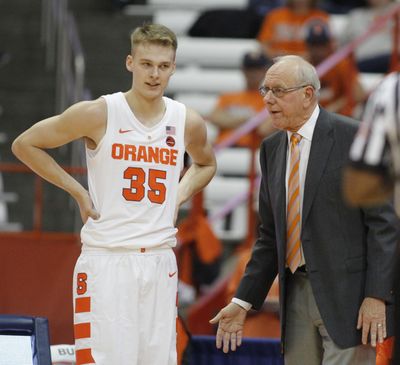 Syracuse coach Jim Boeheim, right, talks to his son Buddy Boeheim, left, during the first half of the team's college basketball exhibition game against Le Moyne in Syracuse, N.Y., Wednesday, Oct. 31, 2018. (AP Photo/Nick Lisi) ORG XMIT: NYNL109 (Nick Lisi / AP)