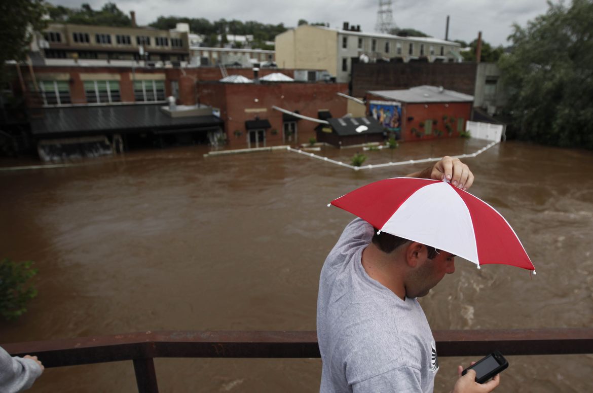 Irene downgraded from hurricane to tropical storm A picture story at