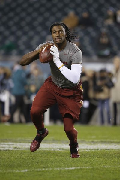 FILE - In this Dec. 26, 2015, file photo, Washington Redskins' Robert Griffin III warms up before an NFL football game against the Philadelphia Eagles, in Philadelphia. Cleveland's never-ending search for a franchise quarterback could come down to a competition between RG3 and one of the two rookies this summer. (AP Photo/Matt Rourke, File) ORG XMIT: NY161 (Matt Rourke / AP)