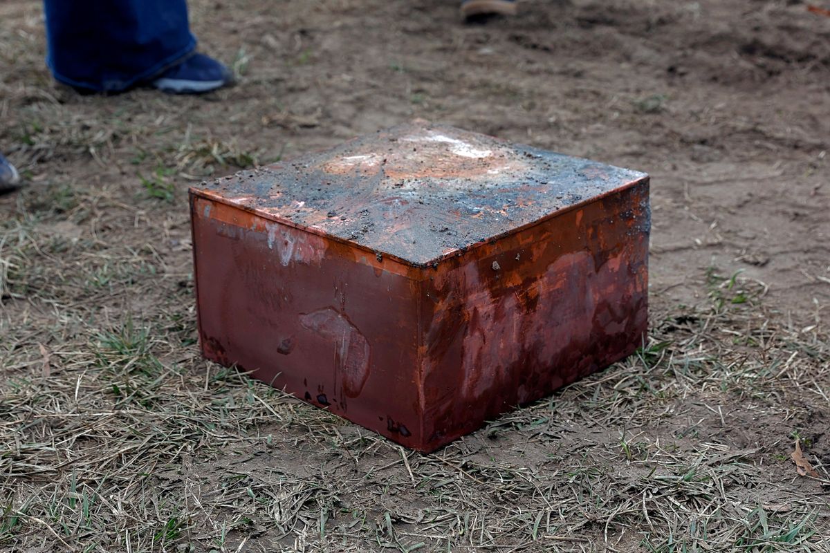 Workers recover a box believed to be the 1887 time capsule that was put under Confederate Gen. Robert E. Lee