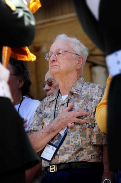
George Chockley, 87 of Mebane, N.C., listens Monday during the presentation of colors at the 65th anniversary of the Battle of Midway on Midway Island. Chockley was a 22-year-old Navy chief petty officer on the USS Enterprise during the battle. 
 (Associated Press / The Spokesman-Review)