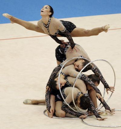 ORG XMIT: KSX116 Team of Brazil perform with the hoop during the Rhythmic Gymnastics World Championships Group All-Around Final in Ise, central Japan, Saturday, Sept. 12, 2009. (AP Photo/Koji Sasahara) (Koji Sasahara / The Spokesman-Review)
