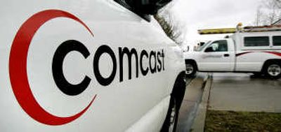 Comcast Corp. shares plunged to a low for the year on Wednesday after the cable operator said 2007 revenue will be lower and expenses higher than previously forecast, citing greater competition and a slowing economy. Associated Press
 (File Associated Press / The Spokesman-Review)