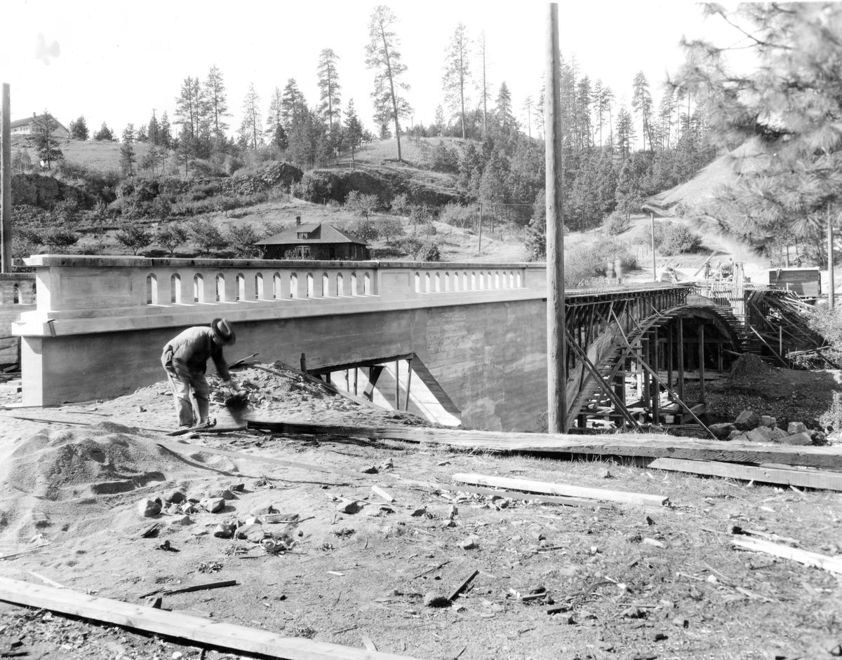 The crew from G.H. Weller, a bridge contractor, works on the 11th Avenue Bridge over Latah Creek in Vinegar Flats in 1927. As the neighborhood platted by farmer-turned-developer Joshua R. Stafford continued to grow, the city replaced a steel and timber bridge that was damaged and salvaged from another spot on Latah Creek. It was a well-used route for horses and buggies to get to Fort Wright, Medical Lake and Cheney.  (WASHINGTON STATE ARCHIVES - DIGI)