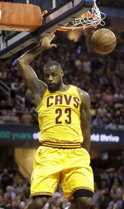 Cleveland forward LeBron James dunks for two of his 38 points. (Associated Press)