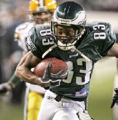 Eagles receiver Greg Lewis runs for a third- quarter score, one of his two touchdowns.
(Associated Press / The Spokesman-Review)