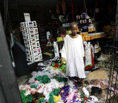 
A boy stands in a store  damaged by Hurricane Katrina's flooding, Aug. 30, 2005. Children living in interim housing almost a year after the storm will get new recreation opportunities through a partnership between FEMA and the charity Save the Children. 
 (File Associated Press / The Spokesman-Review)