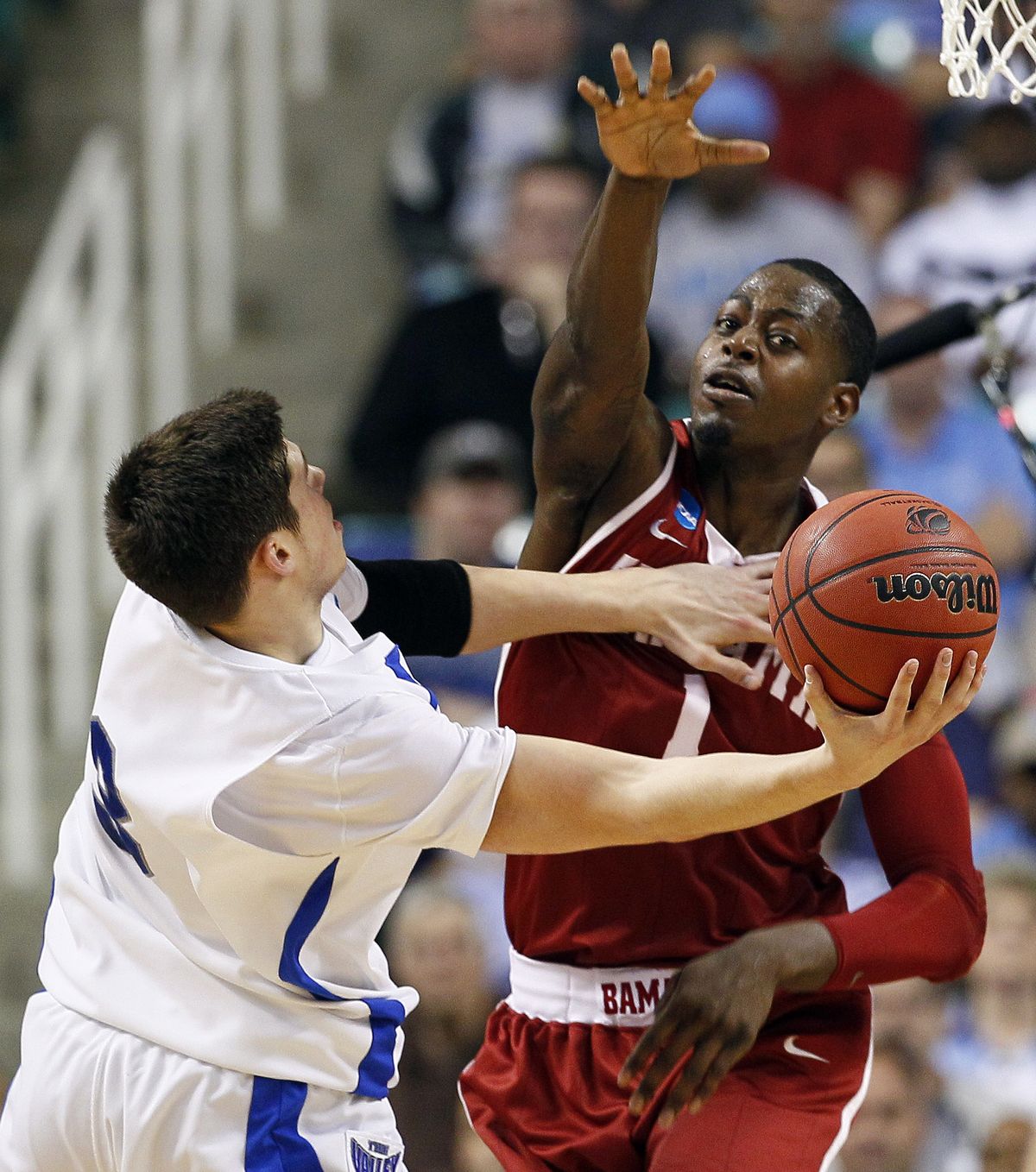 Creighton’s Doug McDermott, left, challenges Alabama’s JaMychal Green in Friday’s game. (Associated Press)