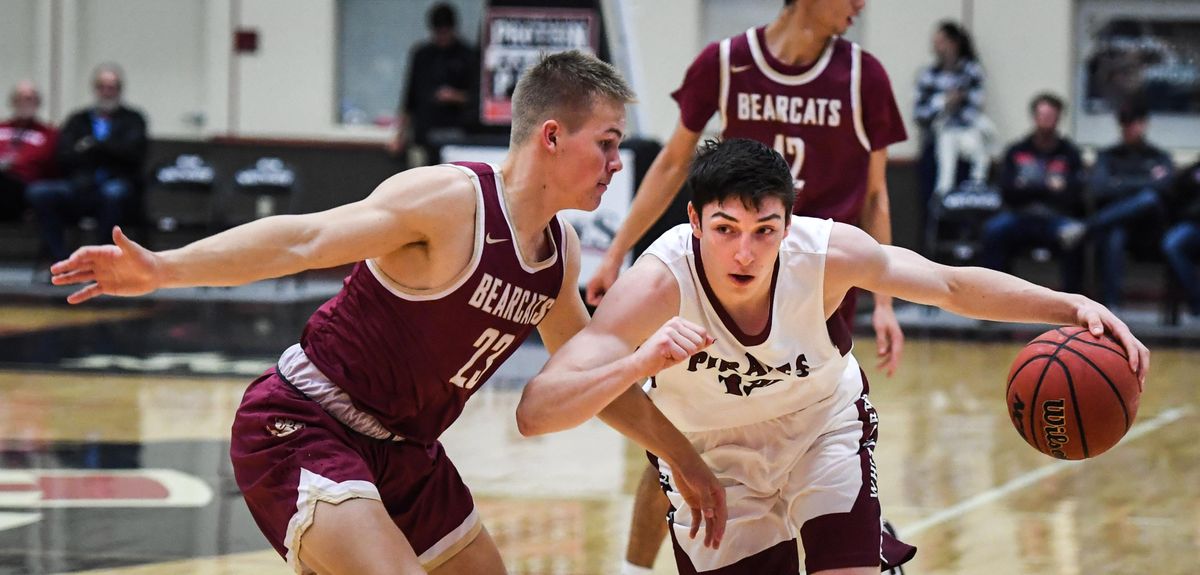 Whitworth guard Sam Lees drives past Willamette guard Jonathan Watts, Friday, Nov 30, 2018, in the Whitworth Field House. (Dan Pelle / The Spokesman-Review)