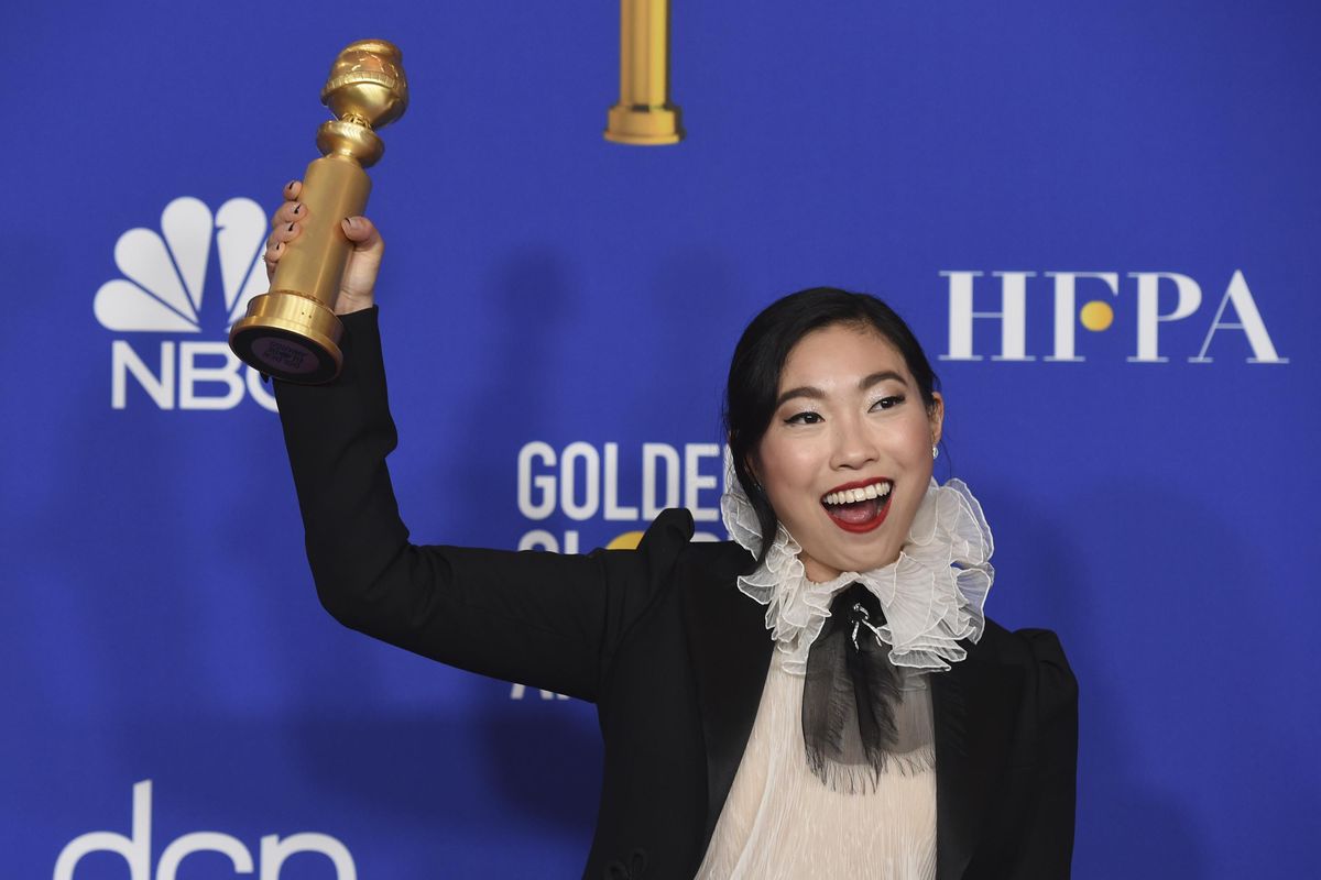 Awkwafina poses in the press room with the award for best performance by an actress in a motion picture, musical or comedy for "The Farewell" at the 77th annual Golden Globe Awards at the Beverly Hilton Hotel on Sunday, Jan. 5, 2020, in Beverly Hills, Calif. (Chris Pizzello / Invision/Associated Press)