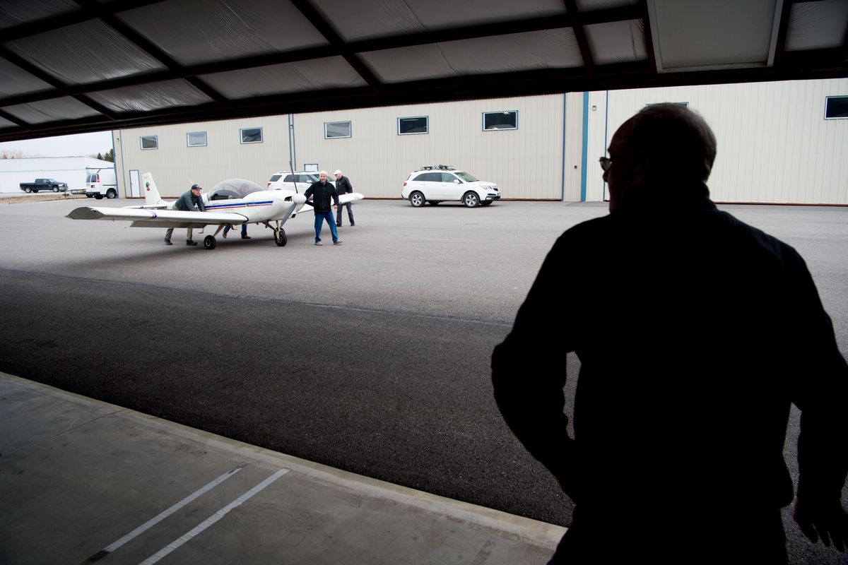 Ray King, the city administrator for Newport, Wash, right, opens a hanger door for his friend Ken Larson, a Gold Seal Flight Instructor, brings his airplane in on Tuesday, April 3, 2018, at the Sandpoint Airport in Sandpoint, Id. King is working to get the city of Newport to build an airport. (Tyler Tjomsland / The Spokesman-Review)