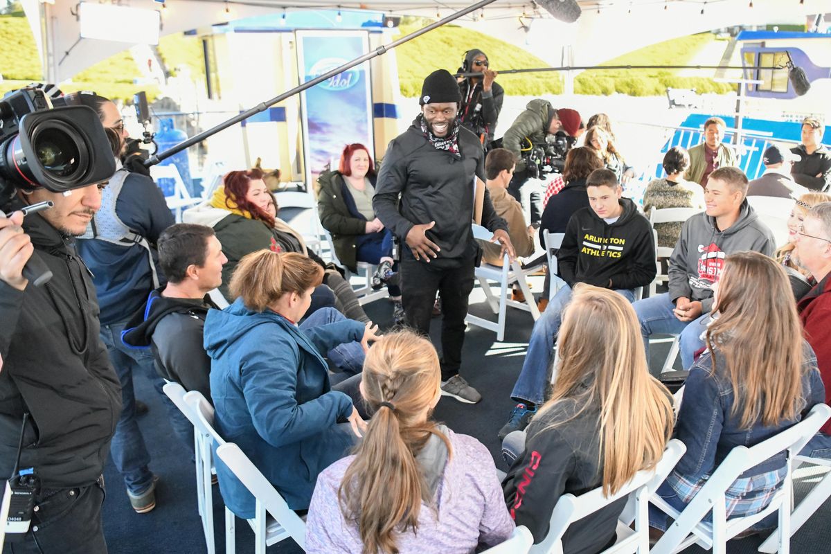 A director talks to a group of contestants and their friends and family before filming begins of candid moments in the holding area as they wait for the second round of auditions for American Idol aboard a Coeur d’Alene Cruises boat parked at the Coeur d’Alene Resort Golf Course, Sunday, Oct. 14, 2018. (Jesse Tinsley / The Spokesman-Review)