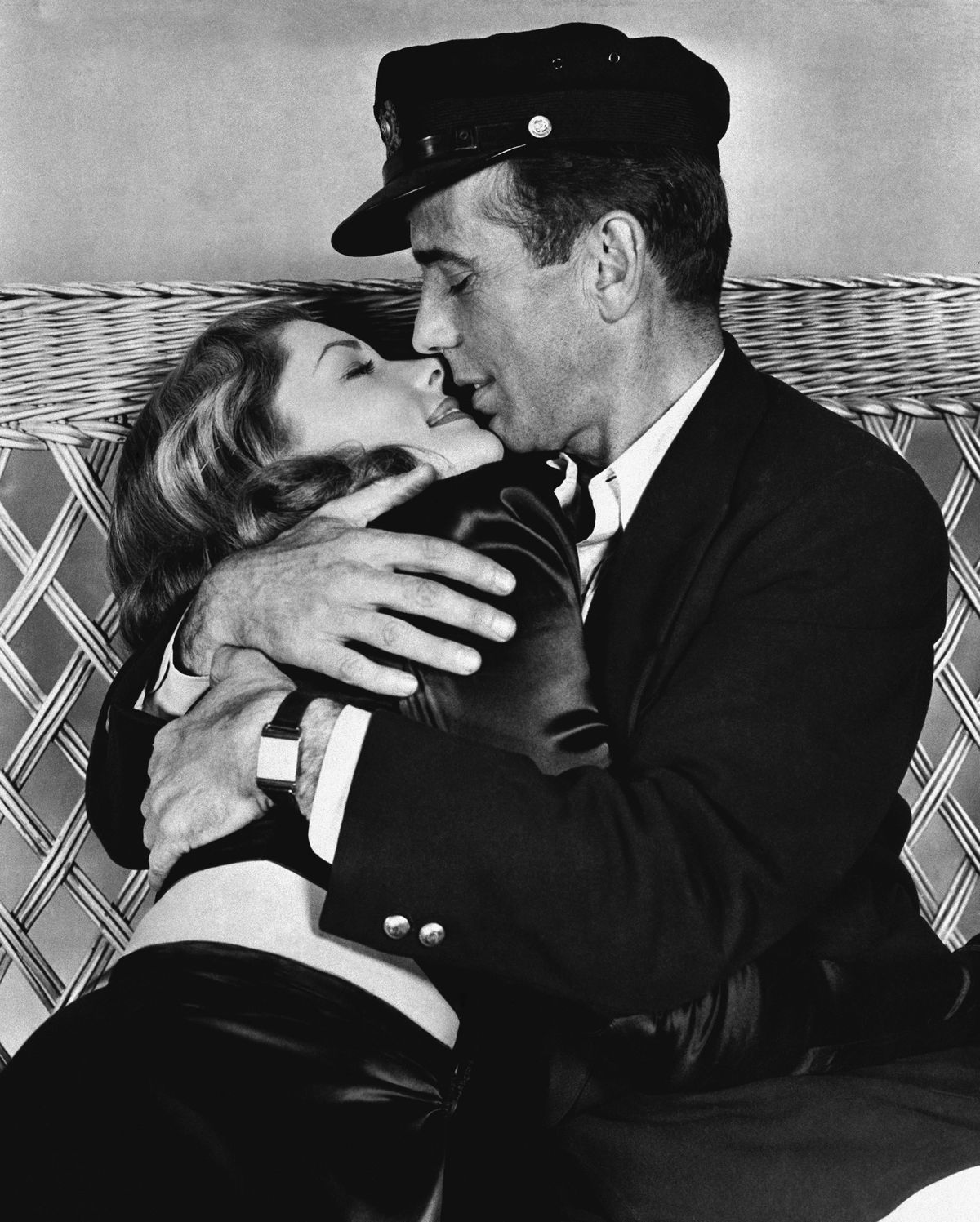 FILE - This 1944 file photo originally released by Warner Bros. shows actor Humphrey Bogart, right, holding actress Lauren Bacall in a scene from, "To Have and Have Not." Bacall, the sultry-voiced actress and Humphrey Bogart;s partner off and on the screen, died Tuesday, Aug. 12, 2014 in New York. She was 89. (Warner Bros.)